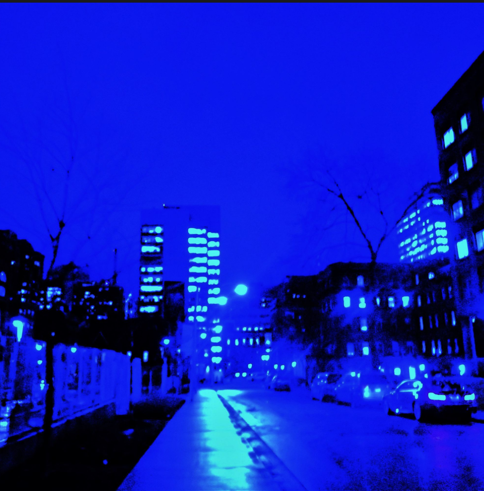 A city street, royal blue, green shadows on the sidewalk, in pools, Old and new buildings, black/purple blue. Some cars on the right side parked. On the left hoarding. In the distance downtown office towers. An eerie, haunted empty and lonely tone. 